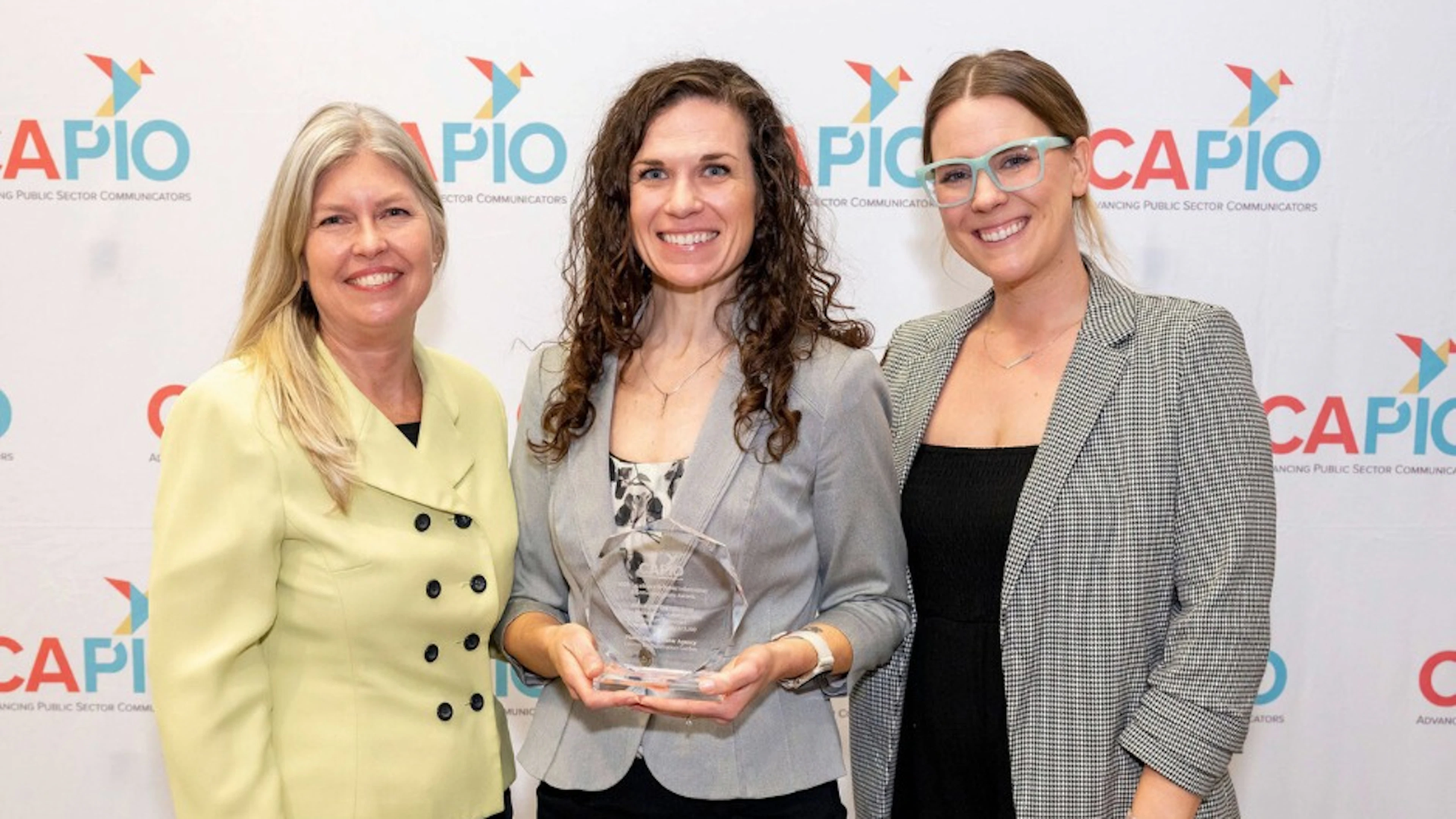Christine Kohn, Brie Coleman, and Julia Griffin accepting the CAPIO EPIC Award for the Loomis Demonstration Garden video