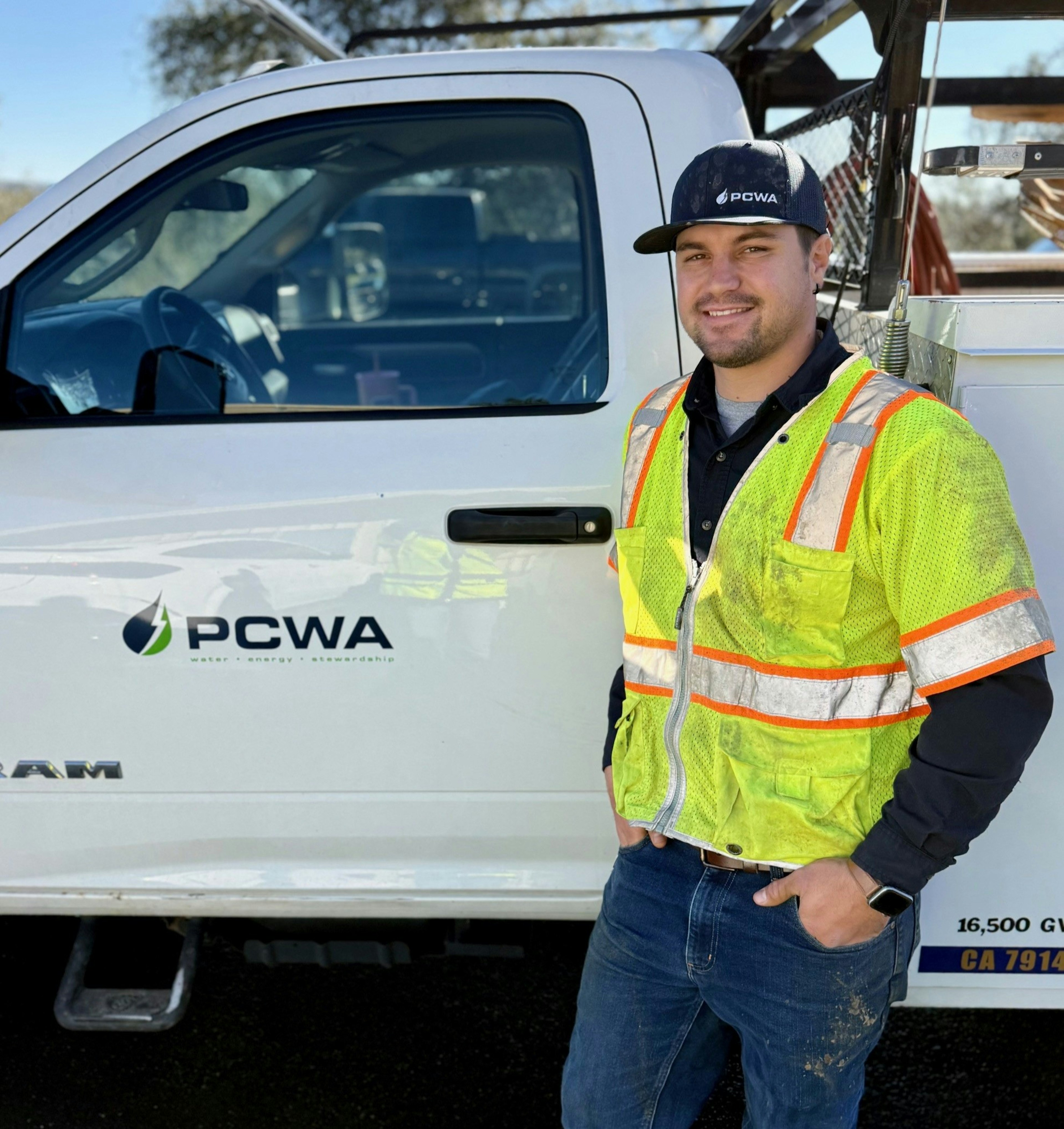 A photo of a PCWA Employee near an identified PCWA service truck
